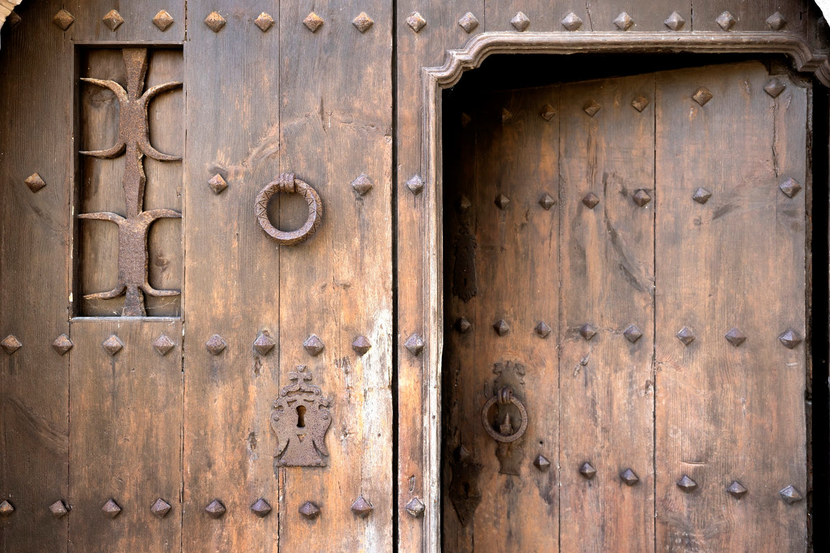 Weathered wooden doors at the masia
