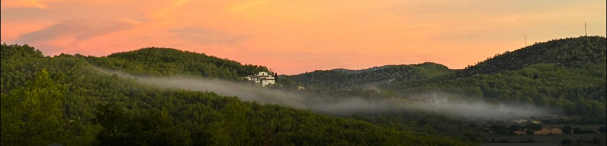 Fog settling over the Garraf hills at sunset