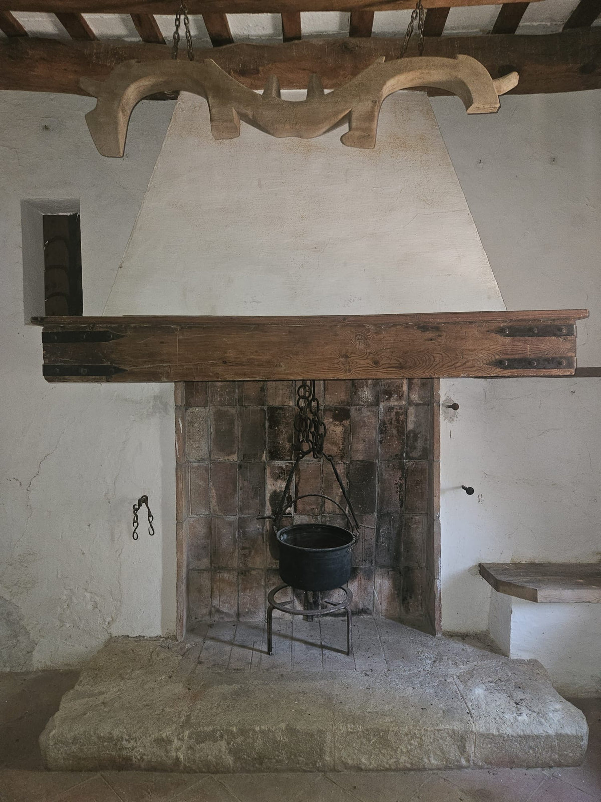 The old hearth with an iron cauldron